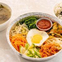 Bibimbap · assorted seasoned vegetables, a sunny-side up egg and red pepper paste sauce. Plus Korean si...
