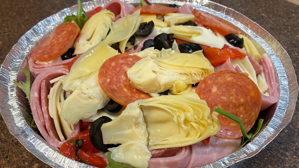 Cold Antipasto · Mixed greens, fresh mozzarella, black olives, roasted red peppers, ham, provolone and Italian salami.