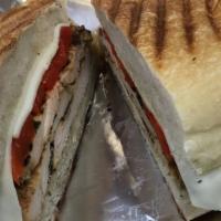 Chicken Panini · Grilled chicken with roasted red peppers, fresh mozzarella, salt, pepper and extra virgin ol...