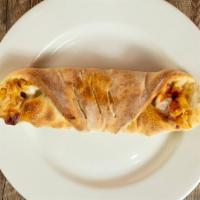 Chicken Roll · Mozzarella and chicken rolled up in homemade pizza dough. Served with a side of tomato sauce.