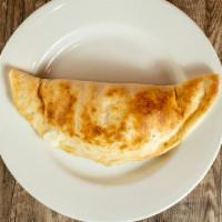 Cheese Calzone · Homemade pizza dough stuffed with ricotta, mozzarella and Parmesan. Served with a side of to...
