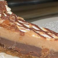 Snickers Pie · Chunks of Snickers bars, fudge brownie, caramel, peanuts, and tart cream cheese filling.