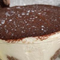 Tiramisu · Lady fingers soaked in espresso, layers with rich mascarpone cheese and dusted with cocoa.