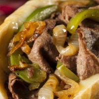 Philly Cheesesteak · Grilled roast beef, peppers, onion & melted swiss.