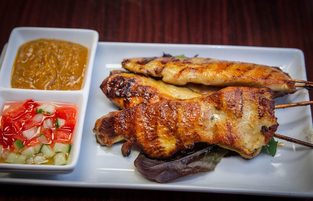 Chicken Sate · Grilled chicken on skewer served with peanut and cucumber sauce. 4 pieces.