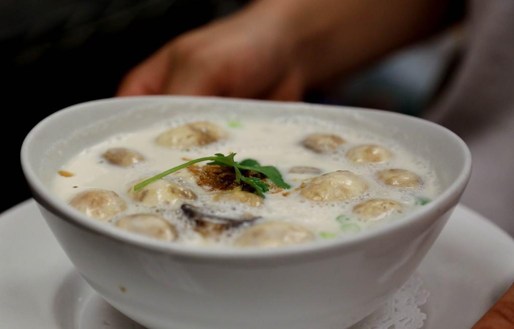 Tom Kha Gai · Thai coconut milk soup with chicken and mushrooms in galangal broth.