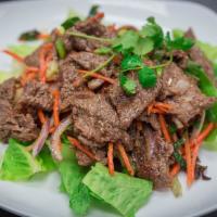 Yum Nua · Beef salad. Grilled beef salad with fresh mint and thai herbs tossed in a spicy lime dressin...