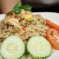 Thai Fried Rice · Thai style fried rice with eggs, carrots, onions and scallions.