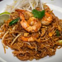Pad Thai · Stir fried rice noodles with eggs, bean curd, bean sprouts, scallions and peanuts.