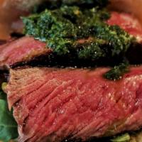 Chimichurri Ribeye · Ribeye steak sliced peppers and topped with our chimichurri sauce and arugula.