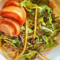 House Salad · A mix of greens and vegetables tossed in our house turmeric vinaigrette.