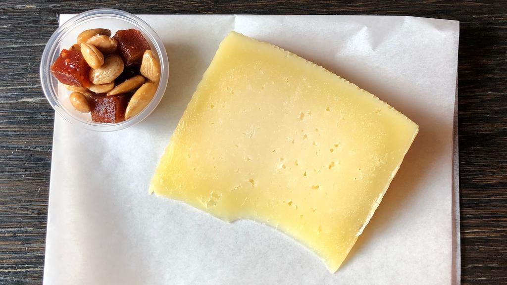 Manchego · Dairy, tree nut. [6 oz] Raw sheep's milk cheese, aged 4 months. Marcona almonds and membrillo.