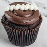 Chocolate Cream · Chocolate cake filled with our signature buttercream topped with fudge frosting and a dollop...