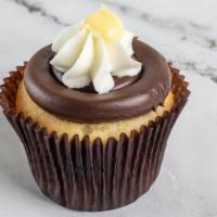Boston Cream · Vanilla cake filled with Bavarian cream, frosted with fudge and topped with whipped cream an...