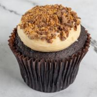 Peanut Butter Cup · Chocolate cake with peanut butter cream cheese frosting topped with peanut butter cups.