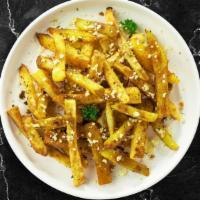 Cheese Fries · Melted vegan mozzarella cheese over potato wedges cooked until golden brown crisp.