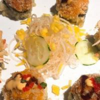Takoyaki · Six pieces. Japanese octopus ball with bonito flakes and Japanese mayo, eel sauce.