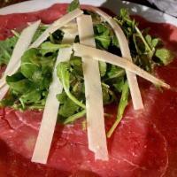 Beef Carpaccio · Arugula, shaved parmesan, truffle oil