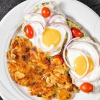 Avocado Toast · Sunny side up eggs, red onions, smashed avocado, cherry tomatoes and lemon on multi-grain.