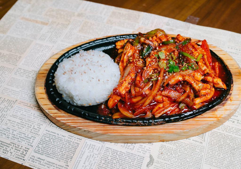 Spicy Stir-Fried Squid Combo · Marinated squid over rice with tofu soup.