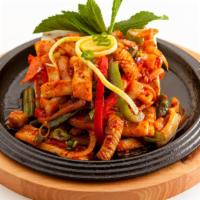 Spicy Stir-Fried Squid · Squid, vegetables, and udon noodles.