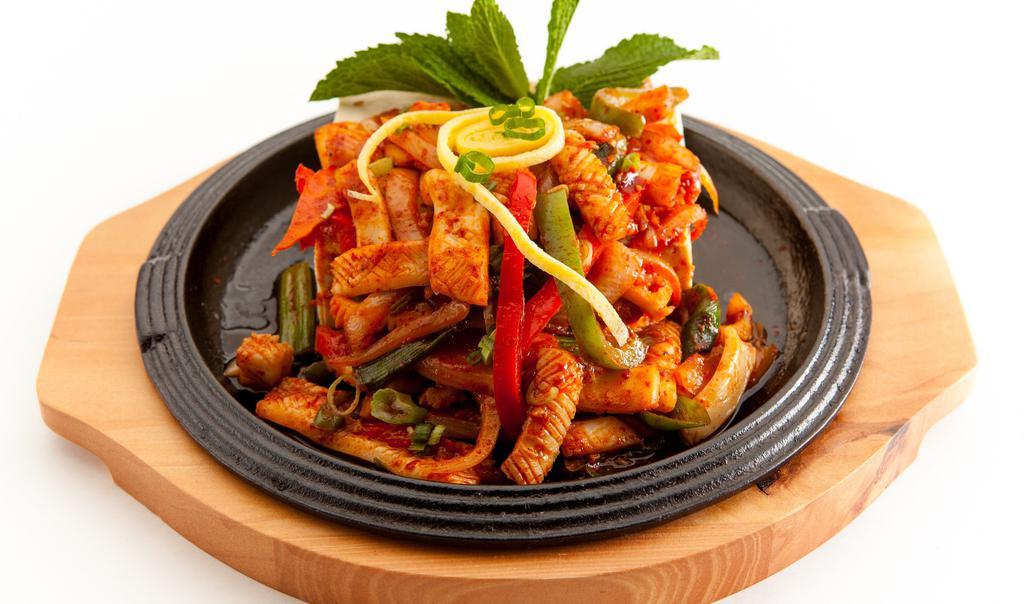 Spicy Stir-Fried Squid · Squid, vegetables, and udon noodles.