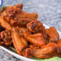 Chicken Wings · Delicious chicken wings smothered in buffalo sauce served with bleu cheese dressing for dipp...