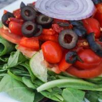 House Salad · Mixed baby greens, sun-dried tomatoes, cucumbers, red and green peppers, tomatoes, olives, a...