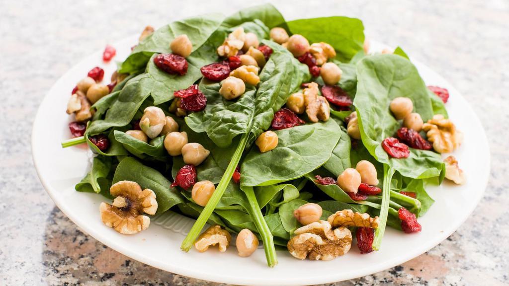 Fresh Spinach Salad · Fresh spinach, roasted walnuts, goat cheese, cranraisins, and chicke peas.