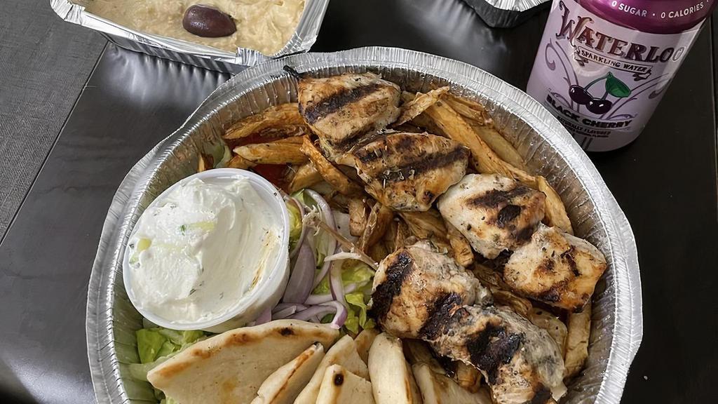 Gyro Platter · Delicious authentic gyro cooked slowly, sliced thinly. Served with pita bread, tzatziki, lettuce, tomatoes, red onions, and fried potatoes..