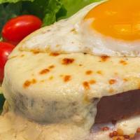 Croque - Madame  · 1 egg, ham, cheese, bechamel sauce.
