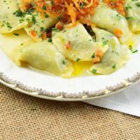 Pierogies “Shvabsky Style” · Handmade Pierogies with spinach and veal, served with crackling