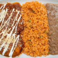 Plato De Chiles Rellenos · Served with salad, rice, beans, and tortillas.
