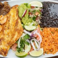 Plato De Mar Y Tierra · Beef, chicken, and shrimp. Served with salad, rice, beans, and tortillas.