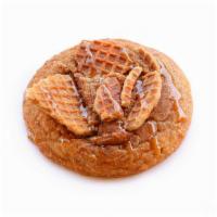 Snickerdoodle · Snickerdoodle cookie topped with stroopwafel pieces and a caramel drizzle