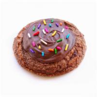 Brownie Batter · Brownie Batter cookie topped with chocolate fudge frosting and rainbow sprinkles