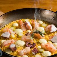 Paella De Mariscos · A banda rice, red shrimps, octopus squid, aioli.