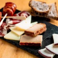 Tabla De Quesos · Cheese plate. Manchego, majorero, mahon, roncal quince paste, served with walnut bread, mixe...