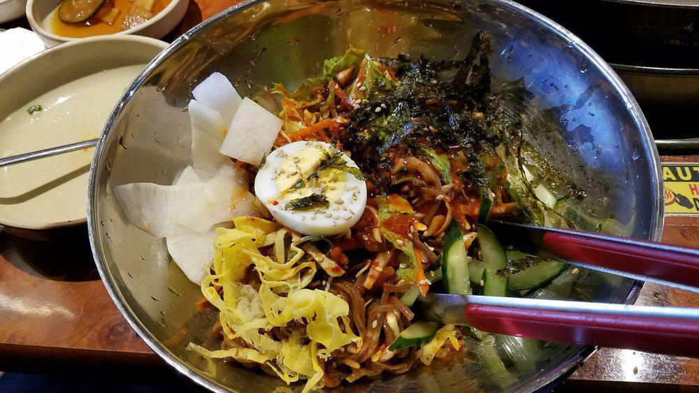 Bibim Makguksu 비빔 막국수 香辣蕎麥麵 · Spicy buckwheat noodles.