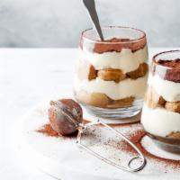 Tiramisu Cup · Slightly sweet and tangy mascarpone whipped cream is layered with spiked-coffee-dipped lady ...