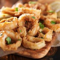 Fried Calamari · Calamari rings are breaded and fried until golden.