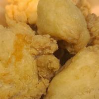 Chicken Bites · 8 pieces of oven-baked crispy chicken bites seasoned with your choice of dust and served wit...