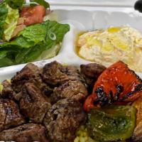 Beef Platter · Soft and seasoned steak. Comes with Hummus, Salad, Rice, Onions & Pepper, and Pita Bread.