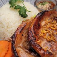 Kao Moo Ob · Grilled marinated pork with steamed vegetables served with jasmine rice and spicy Jaew dress...