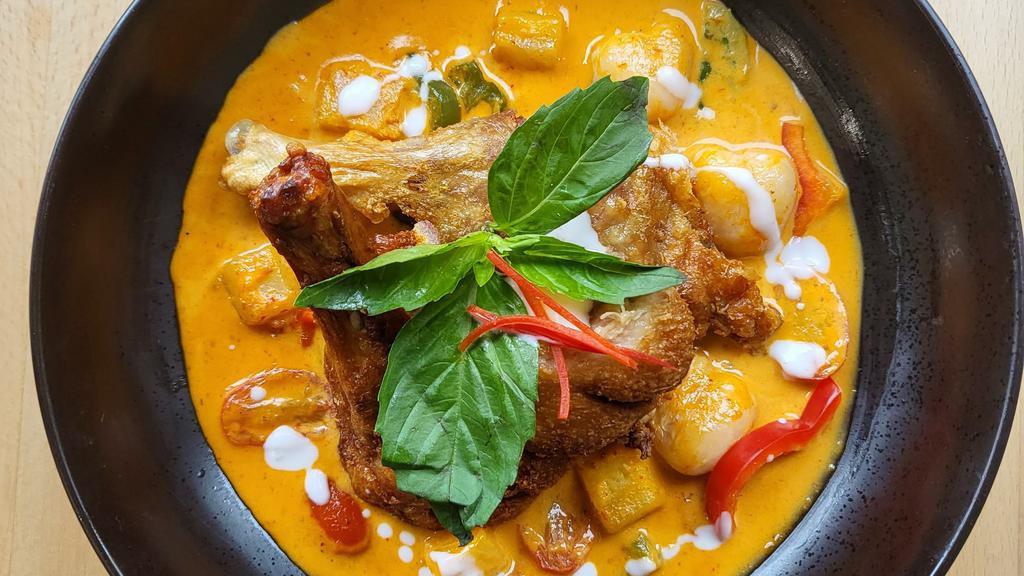 Charm Duck Curry · Spicy** Crispy Half Duck, Bell pepper, Lychee, Grape tomato, Pineapples, Basil leaves, curry paste with coconut milk.