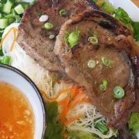 Sen Mee Moo Yang · Angel hair noodle, grilled marinated pork, mixed green salad, carrot, scallion, cucumber top...