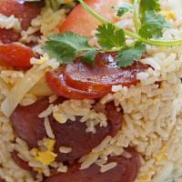 Chinese Sausage Fried Rice · Chinese sausage, chinese broccoli, onion, scallion, tomato and egg mixed with rice.