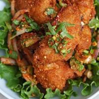Wing Zabb · Spicy**, Deep-fried chicken wings tossed with chili, rice powder, red onion, scallion and ci...