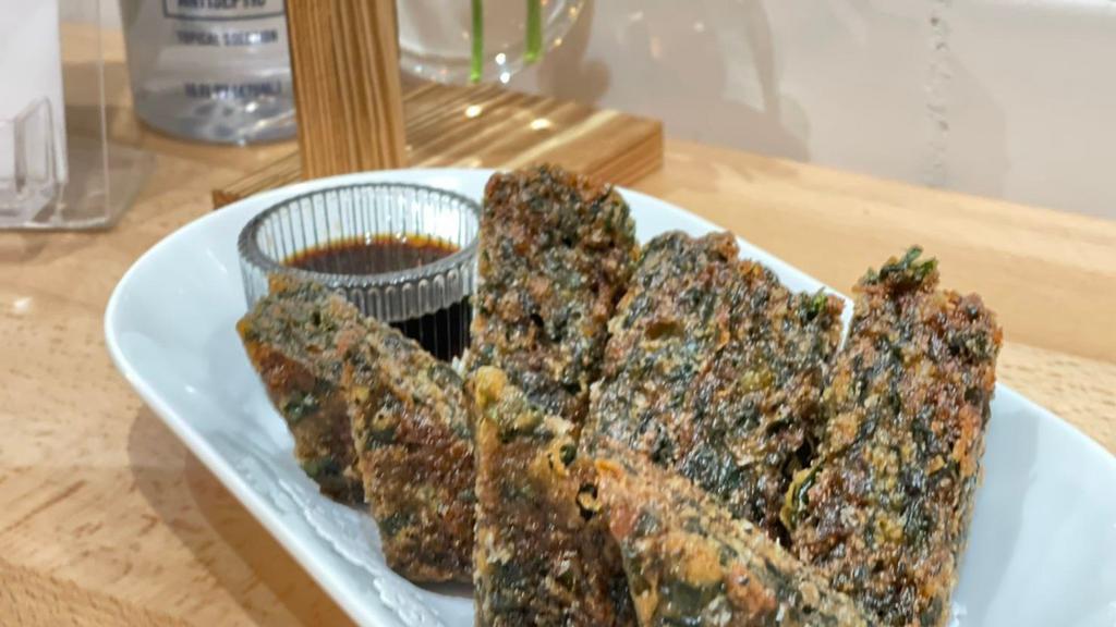 Chive Pancake · Vegetarian. Deep fried chive cake served with sweet soy sauce.