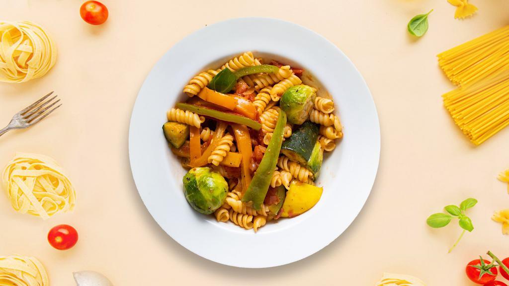 Primavera Pasta · Sautéed seasonal vegetables and tomatoes in a light tomato sauce. Served with fusilli.